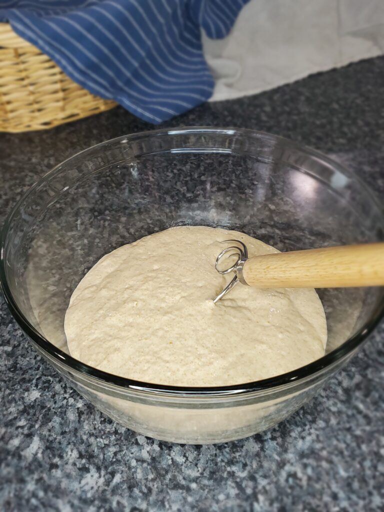 Sourdough starter in glass bowl ready to add ingredients